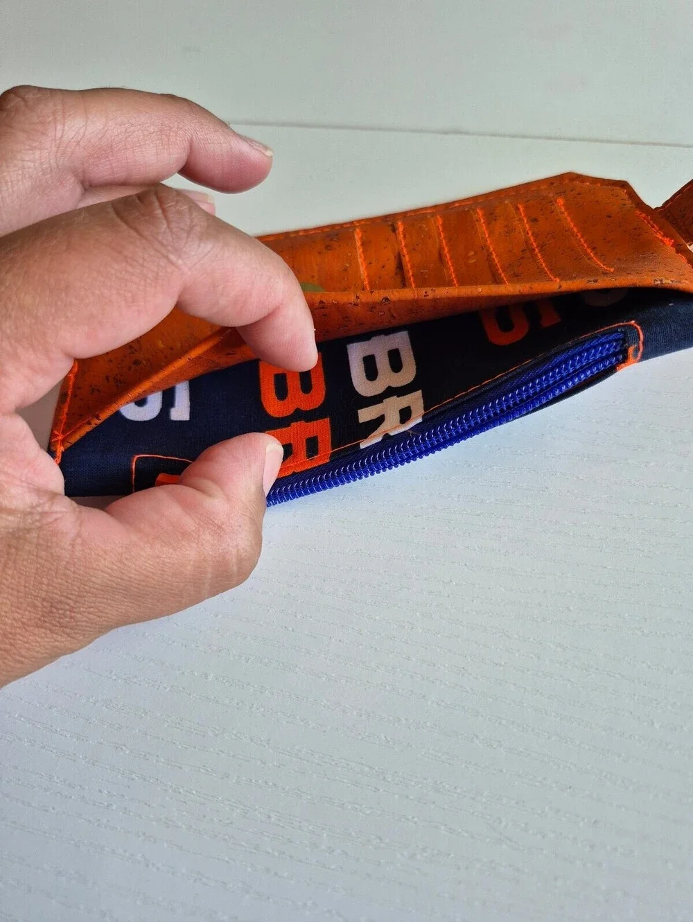 football wallet orange and blue magnetic snap tab 6 card slot wallet